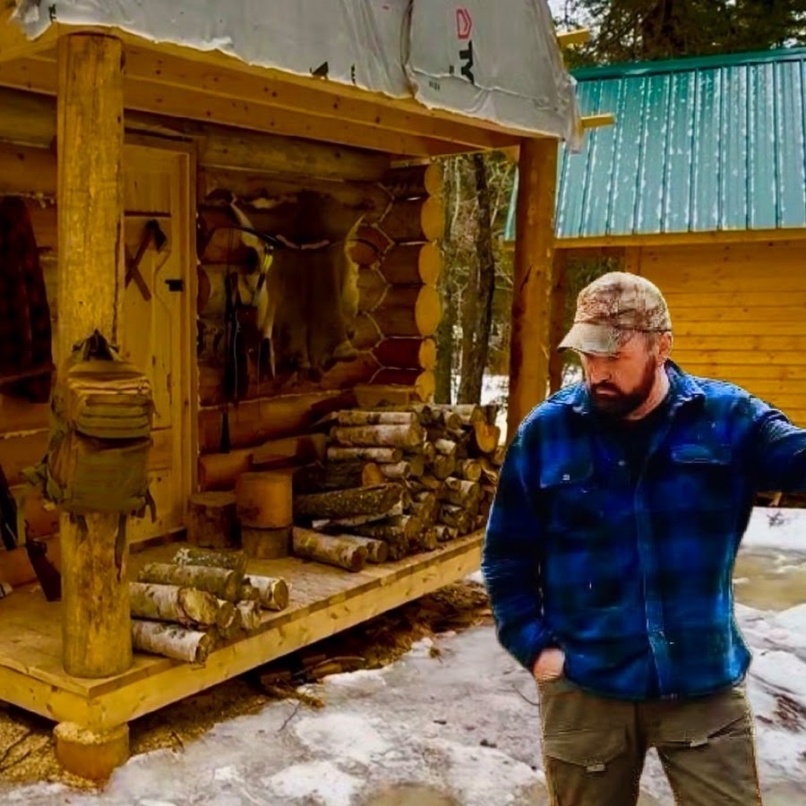 Marcel Doiron outside a log cabin in his official channel photo